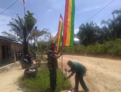 Dalam Rangka Menyambut Hari Jadi Kota Pekanbaru Babinsa Bersama Warga Gotong-royong Pasang Umbul-Umbul